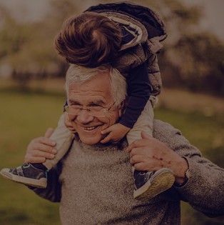 Grandfather with grandson on his shoulders
